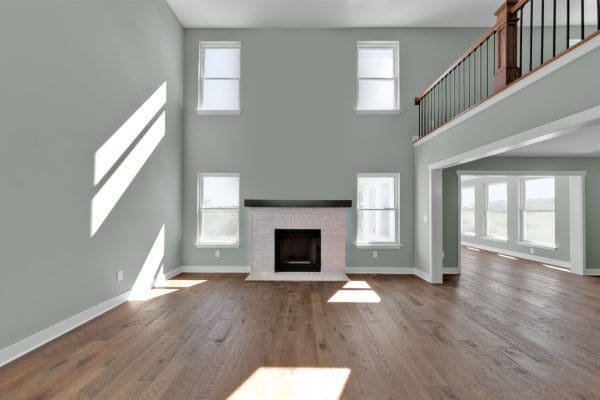 Two story family room with loads of natural lighting.