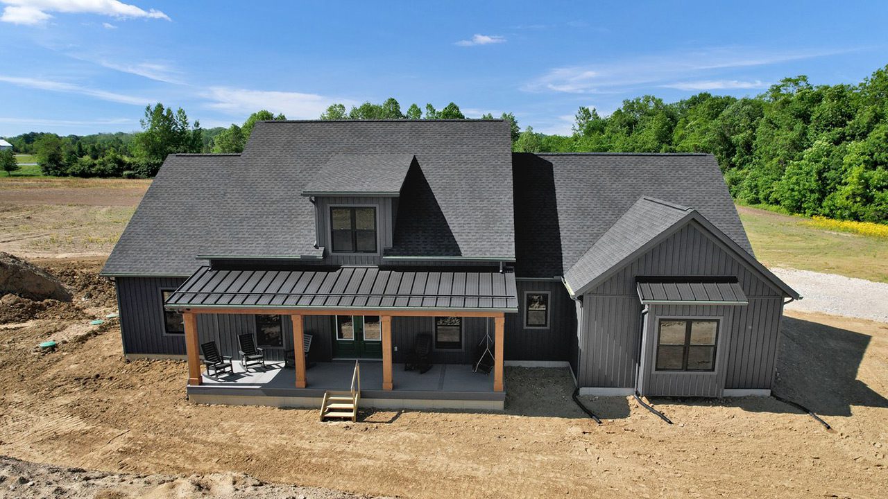 Video walk button that shows the Charles Pointe with nightfall siding.