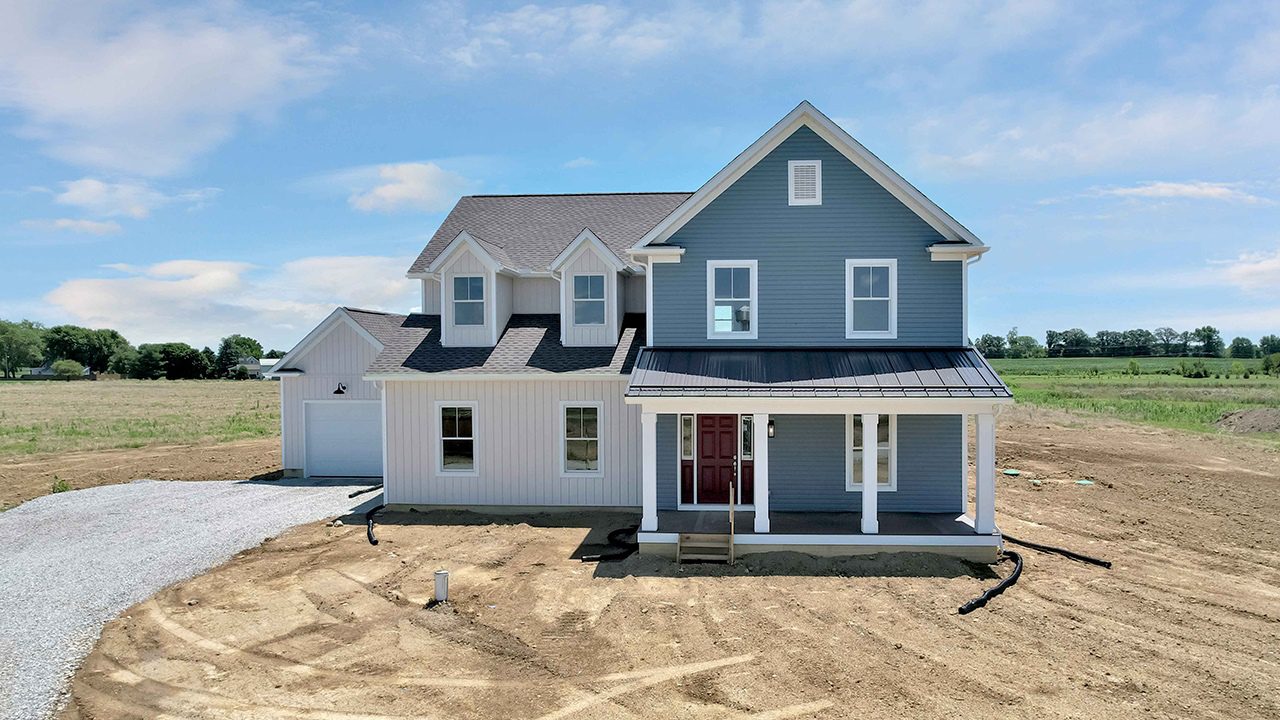 Video walk through photograph of the Crestline with beige and blue siding.