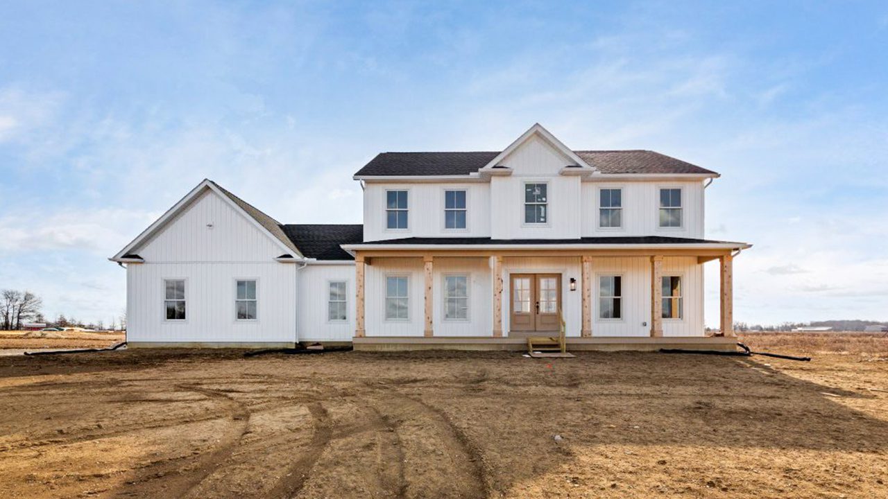Video walk through photograph of the Jefferson farmhouse with white siding.