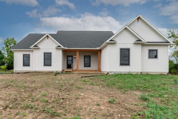 The Clark with gable detail and white board and batten siding.