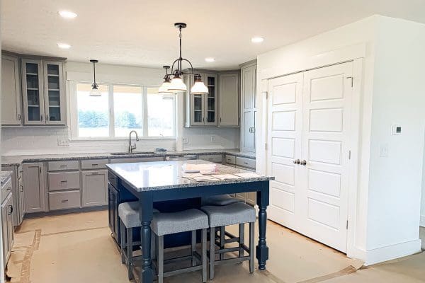 Dover custom kitchen with gray and white cabinets.