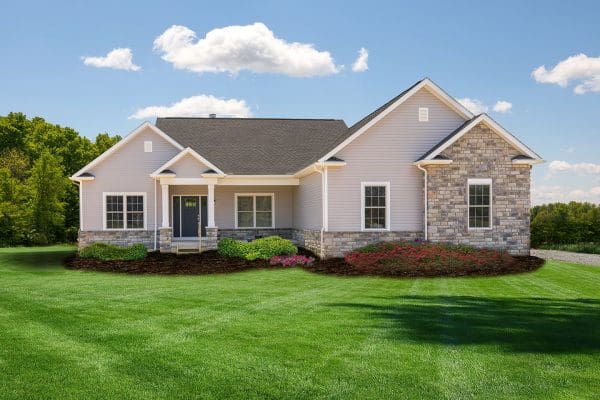 Snider custom Home design with sideload garage, stone front and beige siding in Pickerington.,