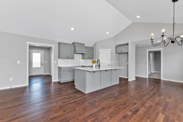 Kitchen in the Newport with gray cabinets and corner pantry.