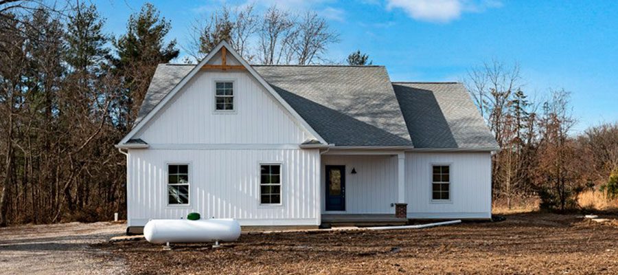 The Anthony with white board and batten siding.