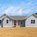 The Butler exterior with blue siding, white trim and red front door.