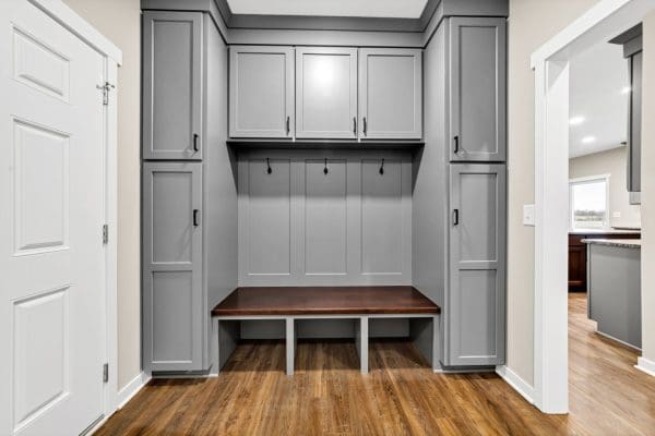 Laundry/Mudroom built-in with tall locker cabinets, bench seating with cubbies below, and cabinets overhead.