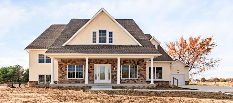 Blog photo of a multi level home with stucco and stone exterior.