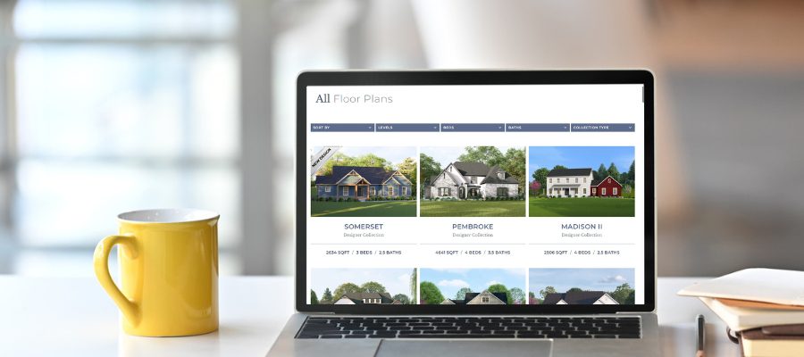 Image of coffee mug, computer, American Heritage Homes website