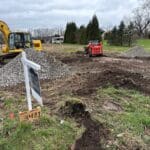 Site grading and excavation work underway on custom home lot