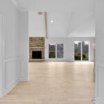 Bright custom home entry with white oak flooring and Westhighland White walls